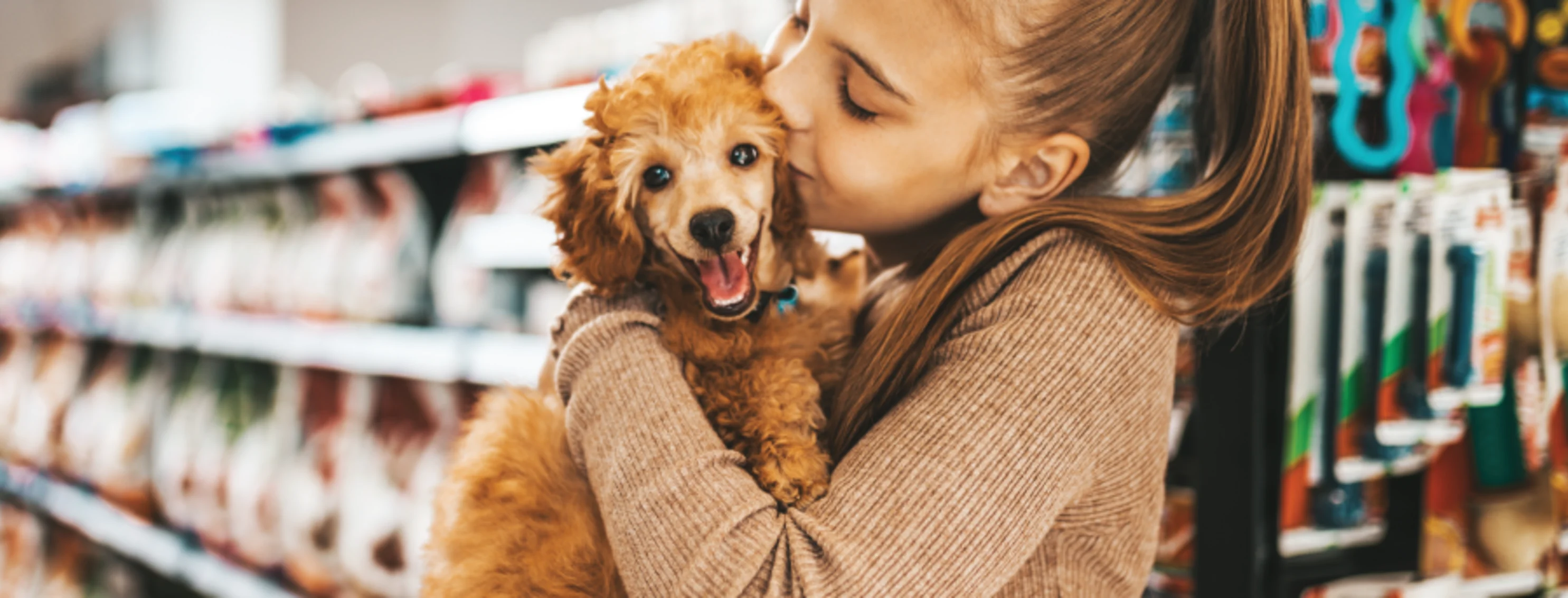 Girl kissing dog 